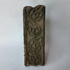 vintage Indian hand-carved wooden printing block showcasing a running border of climbing paisley vines formed by hundreds of fine brass pins embedded in the wood surface